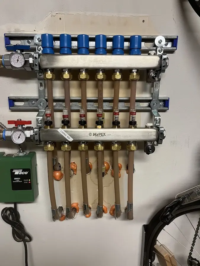 Plumber performing Water Heater Repair at a residential property in Thompson